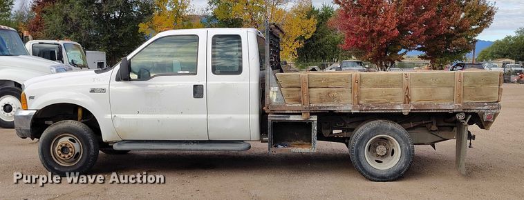 image for item IP9720 2000 Ford F350 Super Duty SuperCab dump flatbed pickup truck