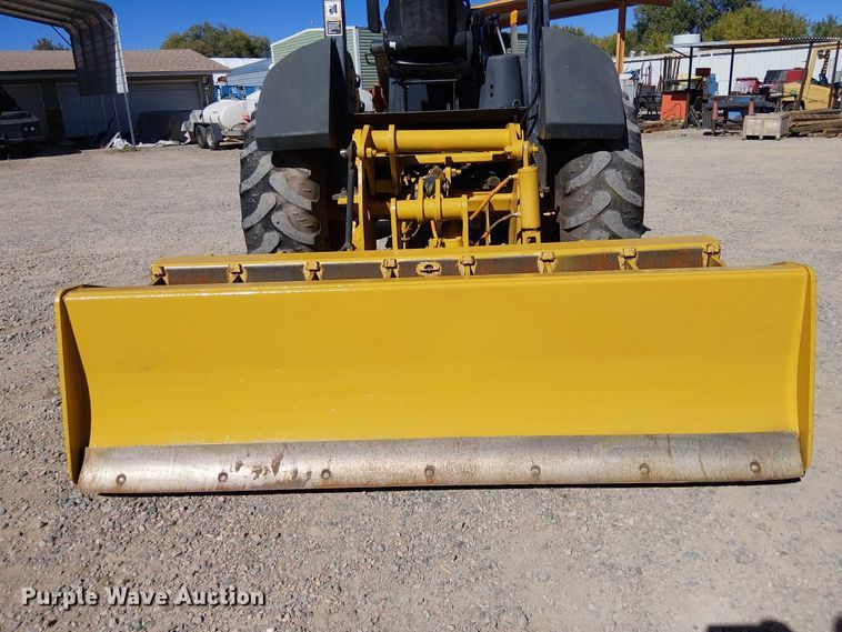 image for item EC1255 2012 John Deere 210K landscape tractor