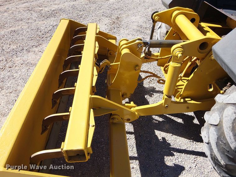 image for item EC1255 2012 John Deere 210K landscape tractor