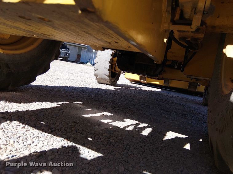 image for item EC1255 2012 John Deere 210K landscape tractor