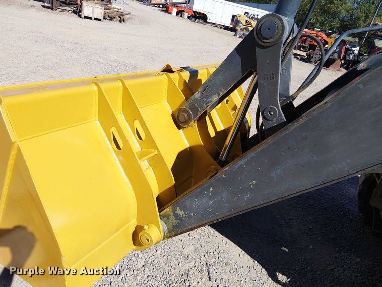 image for item EC1255 2012 John Deere 210K landscape tractor