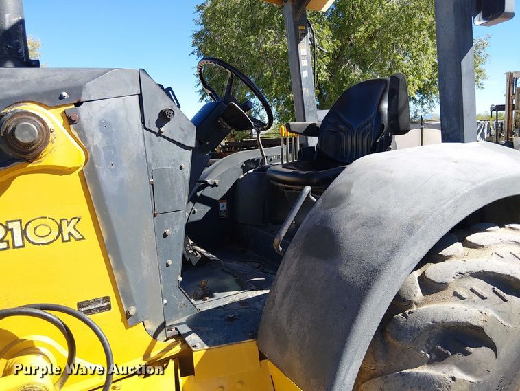 image for item EC1255 2012 John Deere 210K landscape tractor