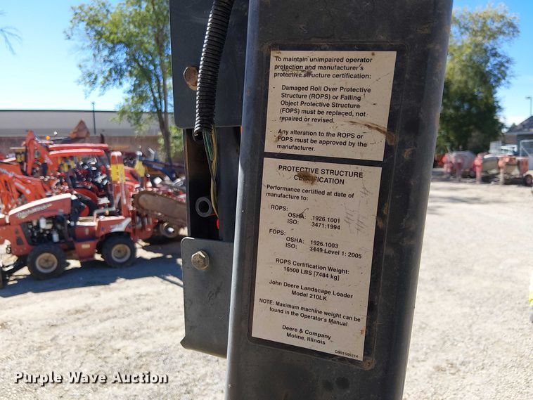 image for item EC1255 2012 John Deere 210K landscape tractor