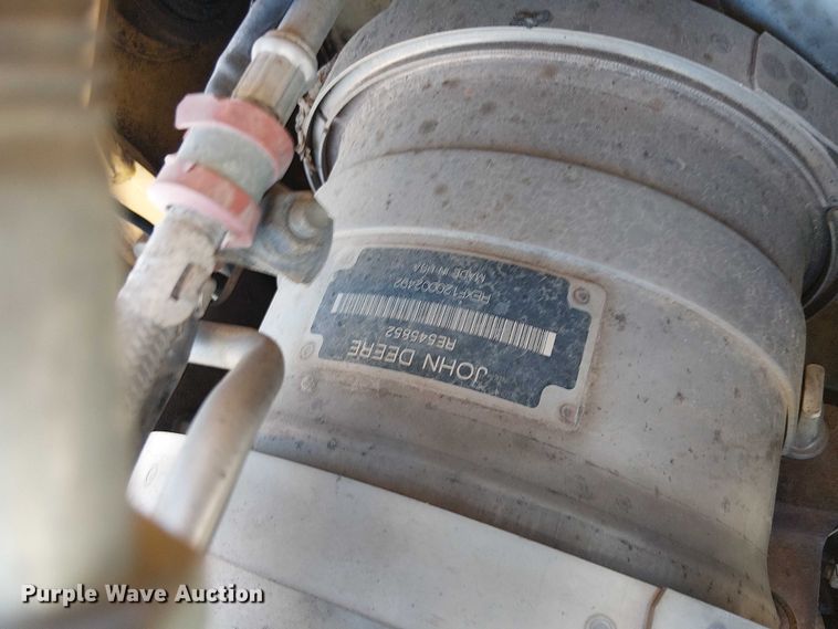 image for item EC1255 2012 John Deere 210K landscape tractor