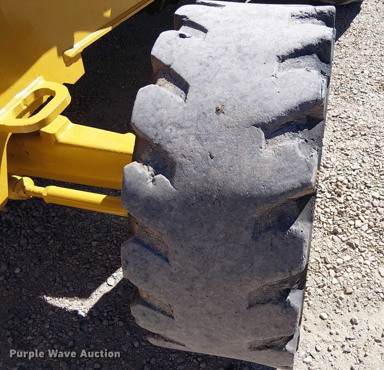 image for item EC1255 2012 John Deere 210K landscape tractor