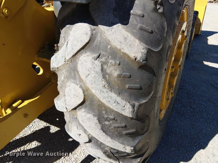 image for item EC1255 2012 John Deere 210K landscape tractor