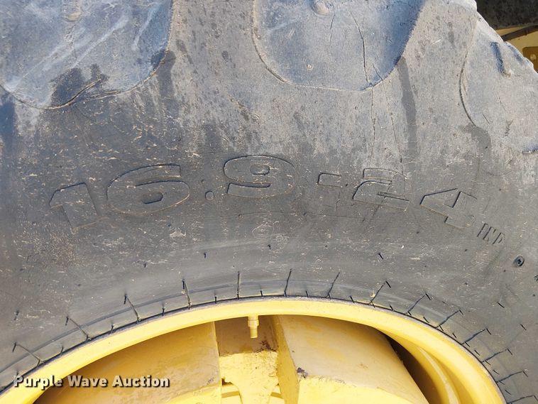 image for item EC1255 2012 John Deere 210K landscape tractor