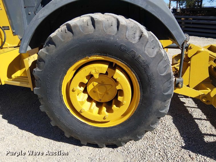 image for item EC1255 2012 John Deere 210K landscape tractor