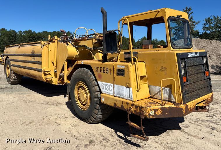 image for item EC3879 1997 Caterpillar 613C Series II water wagon