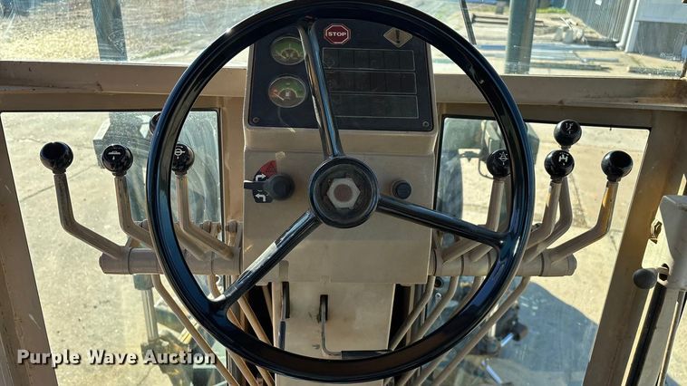 image for item ED2328 1990 John Deere 570B motor grader