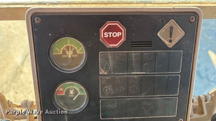 image for item ED2328 1990 John Deere 570B motor grader