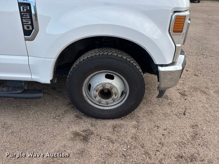 image for item NA9811 2020 Ford F350 Super Duty  Crew Cab flatbed pickup truck