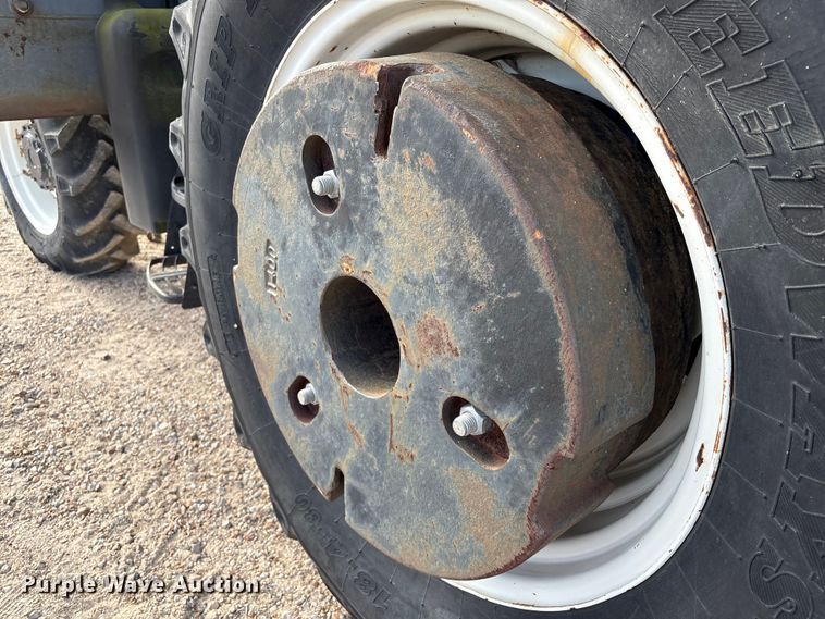 image for item EA7043 New Holland TS115A MFWD tractor