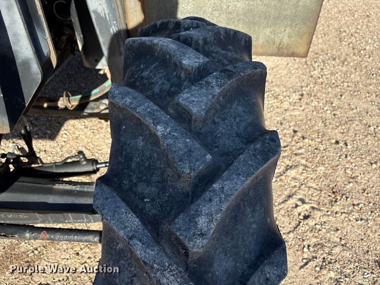 image for item EA7043 New Holland TS115A MFWD tractor