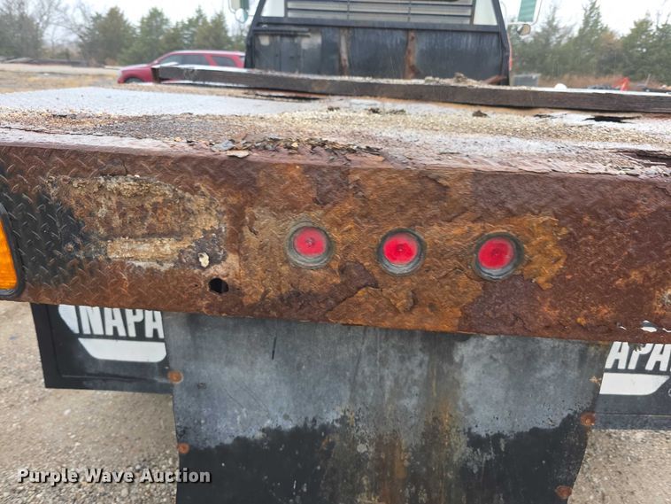 image for item FI0665 1999 International 4900 flatbed truck