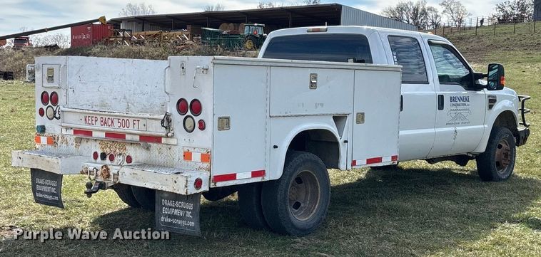 image for item ED2375 2009 Ford F350 Super Duty  Crew Cab utility bed pickup truck