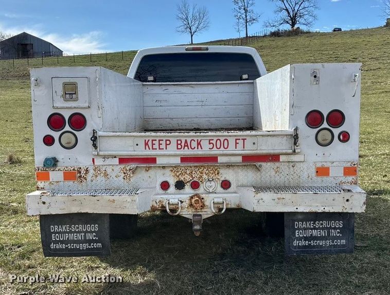 image for item ED2375 2009 Ford F350 Super Duty  Crew Cab utility bed pickup truck