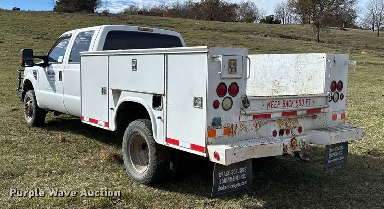 image for item ED2375 2009 Ford F350 Super Duty  Crew Cab utility bed pickup truck