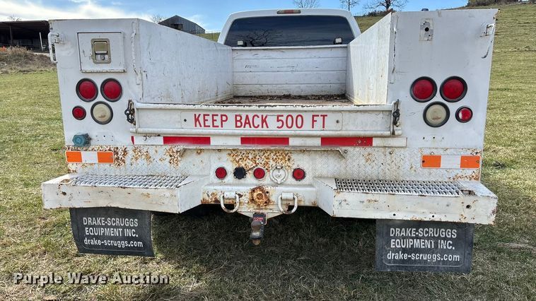 image for item ED2375 2009 Ford F350 Super Duty  Crew Cab utility bed pickup truck