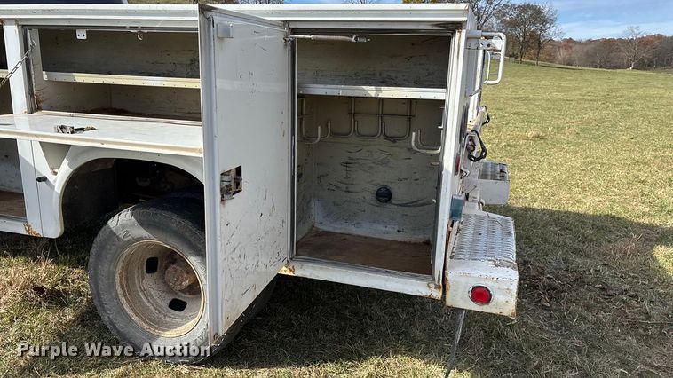 image for item ED2375 2009 Ford F350 Super Duty  Crew Cab utility bed pickup truck