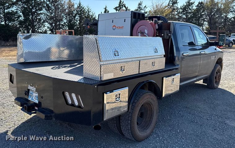 image for item EU5401 2014 RAM 3500 Crew Cab flatbed pickup truck