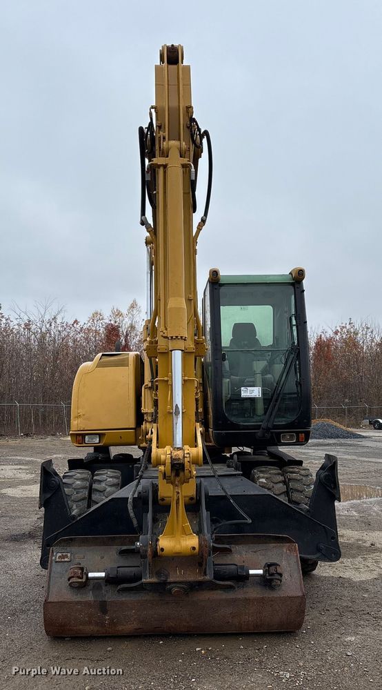 image for item DW7310 2005 Caterpillar M313C wheeled excavator