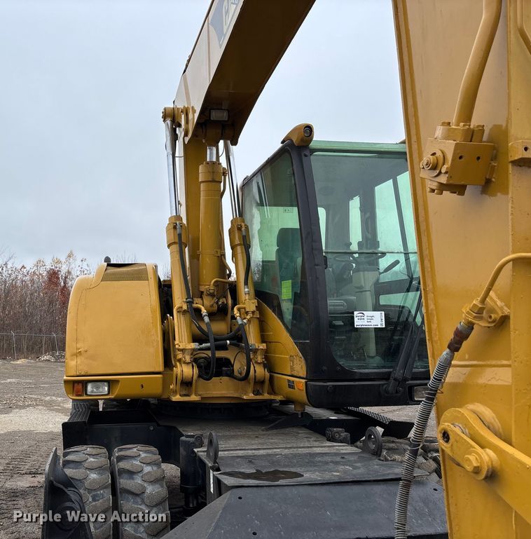 image for item DW7310 2005 Caterpillar M313C wheeled excavator