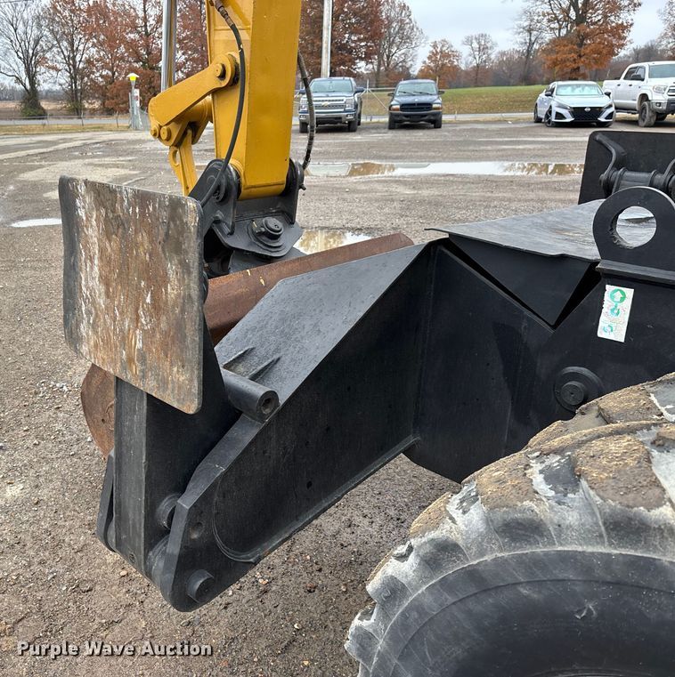 image for item DW7310 2005 Caterpillar M313C wheeled excavator