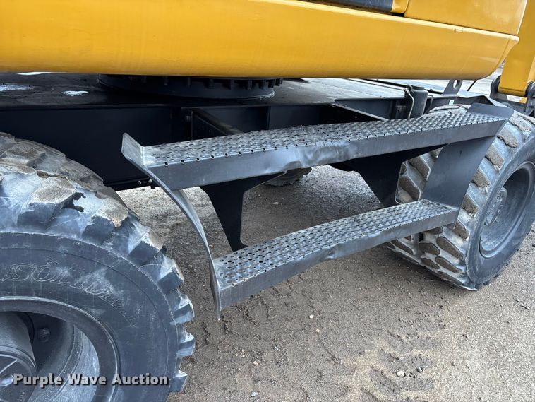 image for item DW7310 2005 Caterpillar M313C wheeled excavator