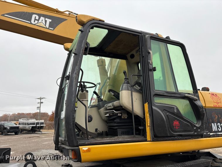 image for item DW7310 2005 Caterpillar M313C wheeled excavator