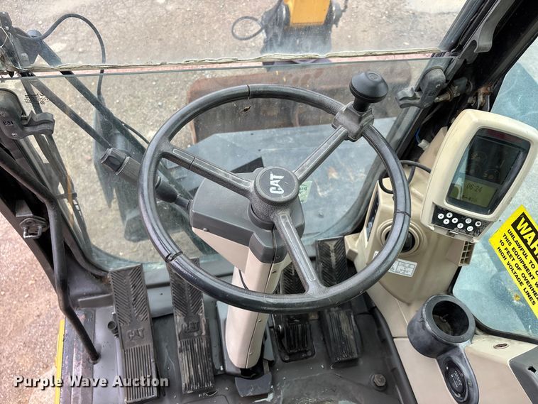 image for item DW7310 2005 Caterpillar M313C wheeled excavator