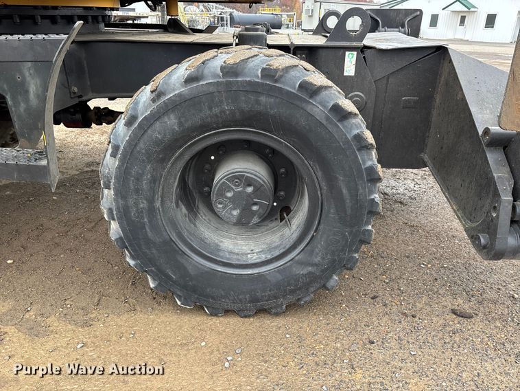 image for item DW7310 2005 Caterpillar M313C wheeled excavator