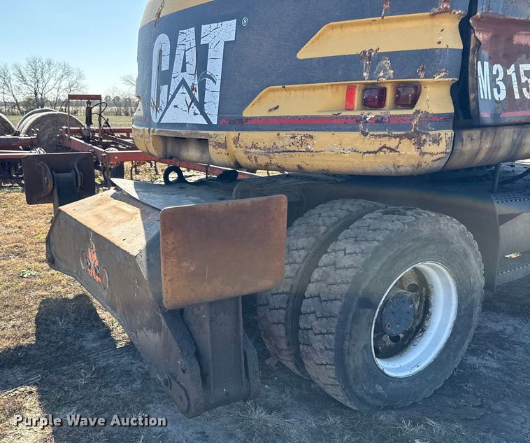 image for item EC4461 2002 Caterpillar M315 wheeled excavator