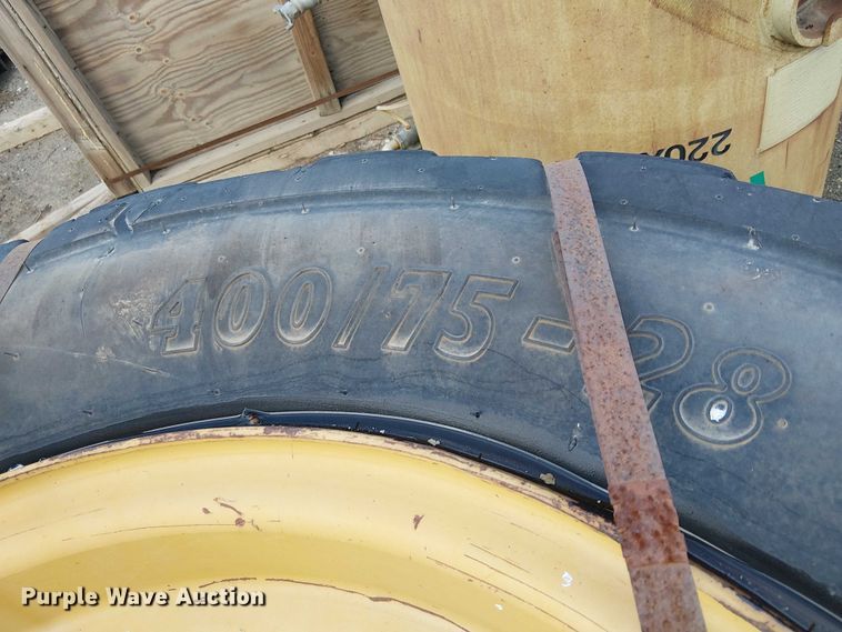 image for item EE4978 (4) 400/75-28 tires and wheels