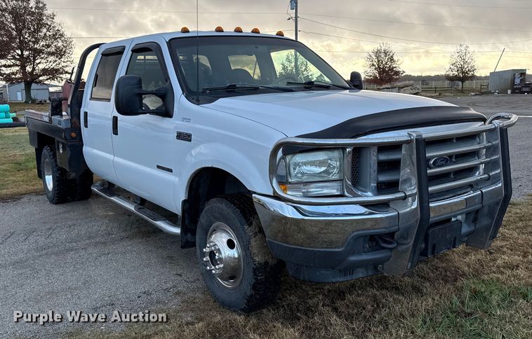 image for item EN0105 2002 Ford F350 Crew Cab bale bed pickup truck