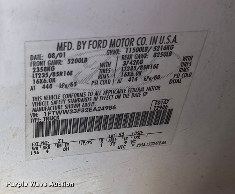 image for item EN0105 2002 Ford F350 Crew Cab bale bed pickup truck