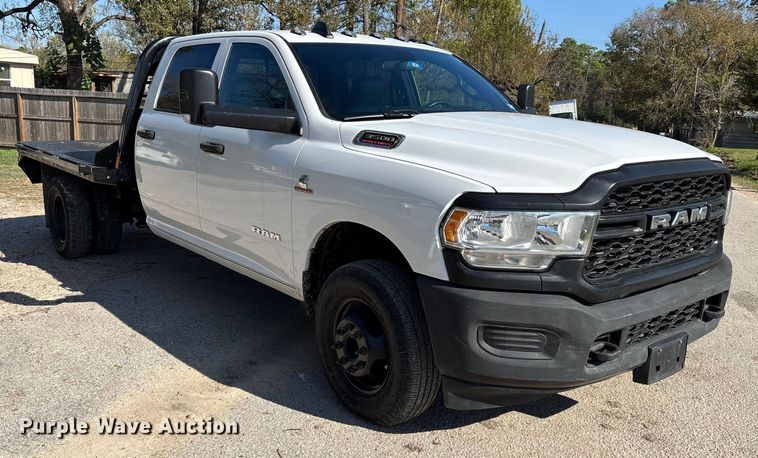 image for item DT4983 2022 RAM 3500HD Crew Cab flatbed pickup truck