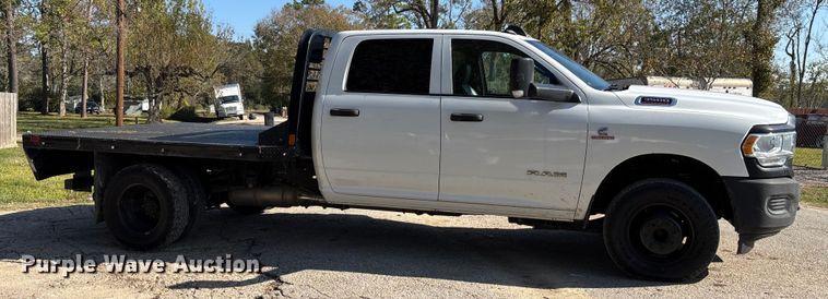 image for item DT4983 2022 RAM 3500HD Crew Cab flatbed pickup truck