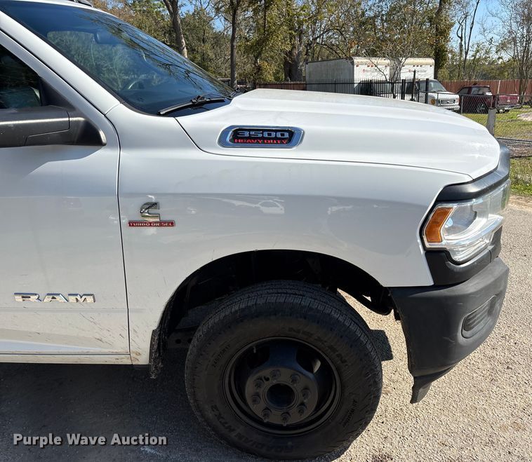 image for item DT4983 2022 RAM 3500HD Crew Cab flatbed pickup truck