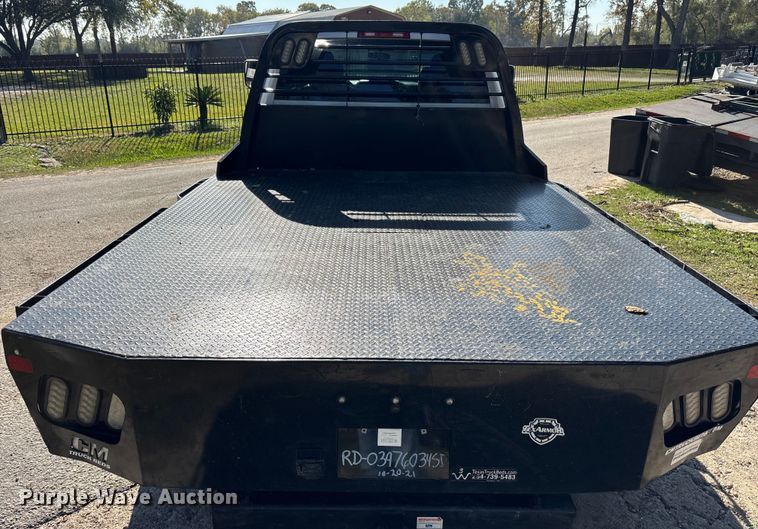 image for item DT4983 2022 RAM 3500HD Crew Cab flatbed pickup truck