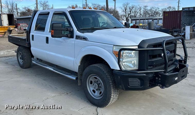 image for item DV0766 2016 Ford F350 Super Duty Crew Cab flatbed pickup truck