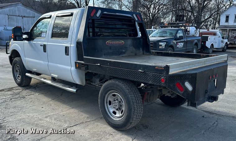 image for item DV0766 2016 Ford F350 Super Duty Crew Cab flatbed pickup truck