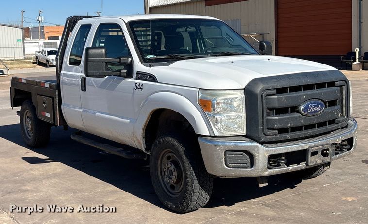 image for item EA7818 2014 Ford F250 Super Duty SuperCab flatbed pickup truck