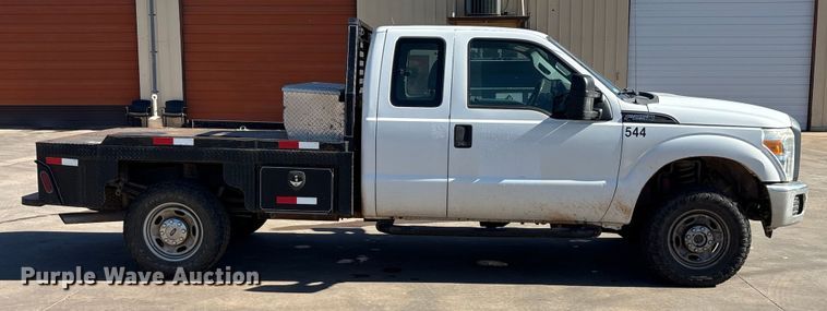 image for item EA7818 2014 Ford F250 Super Duty SuperCab flatbed pickup truck