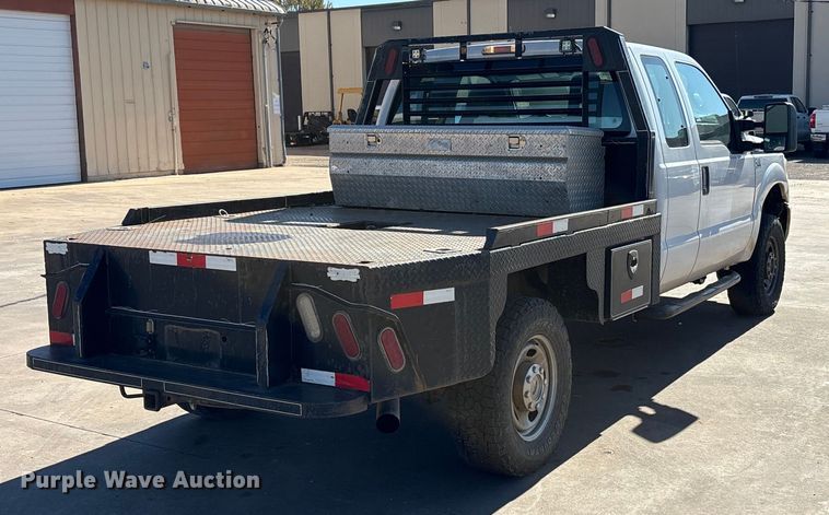 image for item EA7818 2014 Ford F250 Super Duty SuperCab flatbed pickup truck