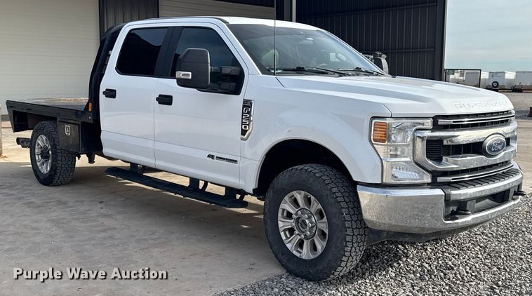 image for item EE4471 2022 Ford F250 Super Duty Crew Cab flatbed pickup truck