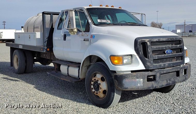 image for item YA1591 2004 Ford  F650 SuperCab flatbed truck