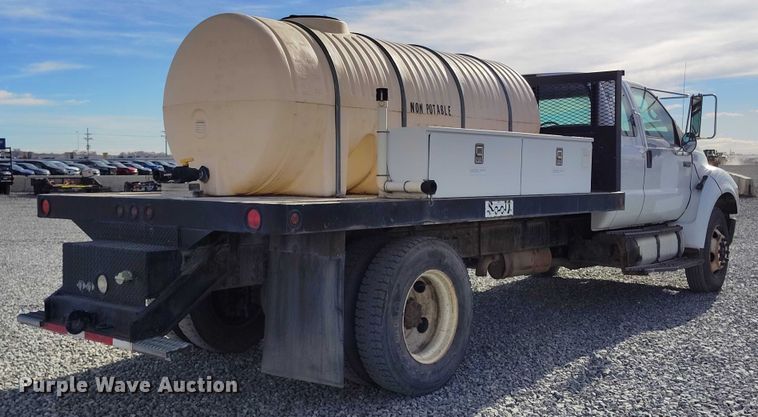 image for item YA1591 2004 Ford  F650 SuperCab flatbed truck