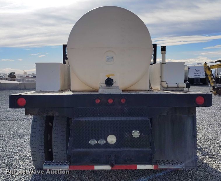 image for item YA1591 2004 Ford  F650 SuperCab flatbed truck