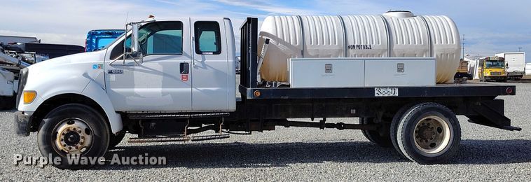 image for item YA1591 2004 Ford  F650 SuperCab flatbed truck